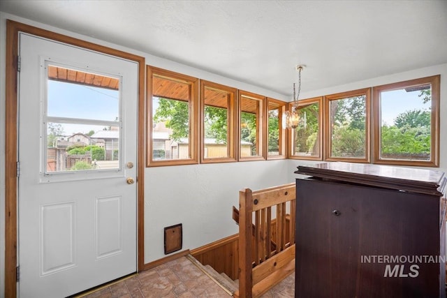 4523 N Mountain View Dr, Boise, ID 83704 - foyer entrance featuring stone finish flooring and baseboards