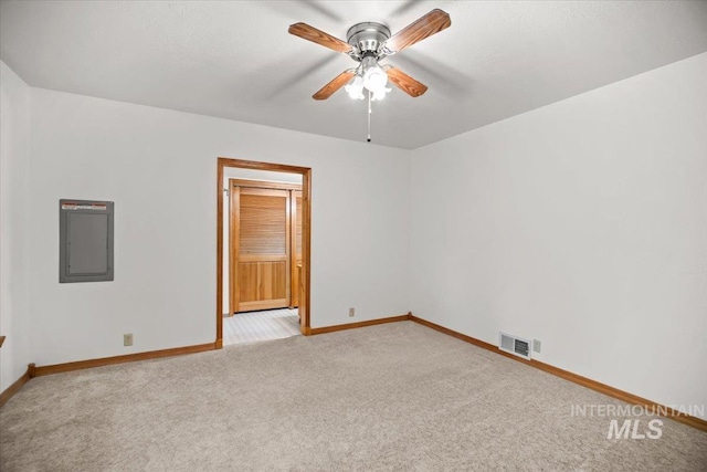4523 N Mountain View Dr, Boise, ID 83704 - empty room with electric panel, light colored carpet, and a ceiling fan