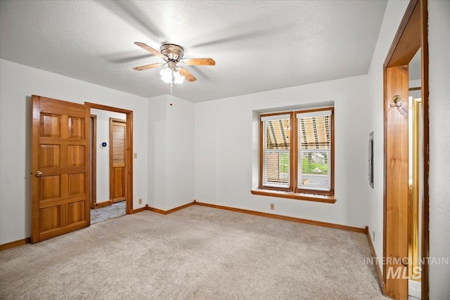 4523 N Mountain View Dr, Boise, ID 83704 - empty room featuring light carpet, a ceiling fan, and a textured ceiling