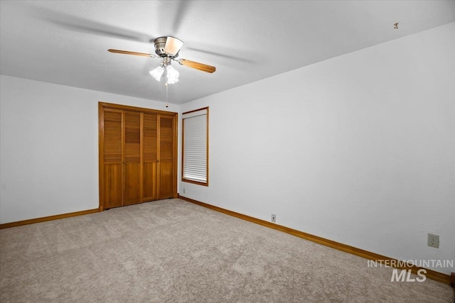 4523 N Mountain View Dr, Boise, ID 83704 - unfurnished bedroom featuring light colored carpet, a closet, and ceiling fan