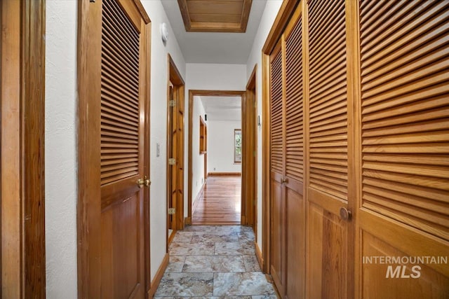 4523 N Mountain View Dr, Boise, ID 83704 - hallway with stone tile floors and baseboards