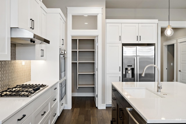 6257 N Vicenza Ln, Meridian, ID 83646 - kitchen with white cabinets, pendant lighting, stainless steel appliances, and sink