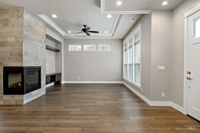 6257 N Vicenza Ln, Meridian, ID 83646 - interior space with a tile fireplace, a wealth of natural light, ceiling fan, and dark hardwood / wood-style floors