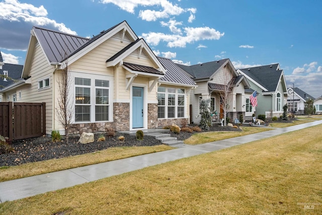 craftsman inspired home with a front lawn