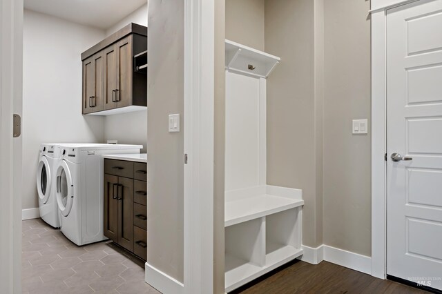 6257 N Vicenza Ln, Meridian, ID 83646 - washroom featuring cabinets, light tile patterned floors, and washing machine and dryer
