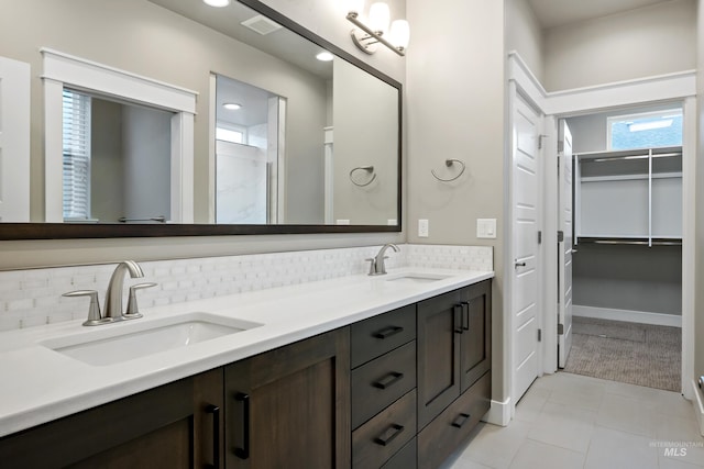 6257 N Vicenza Ln, Meridian, ID 83646 - bathroom with vanity, tile patterned floors, and backsplash