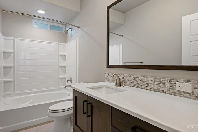 6257 N Vicenza Ln, Meridian, ID 83646 - full bathroom featuring tile patterned flooring, tub / shower combination, backsplash, toilet, and vanity