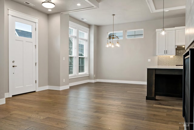6257 N Vicenza Ln, Meridian, ID 83646 - foyer with dark hardwood / wood-style floors and an inviting chandelier