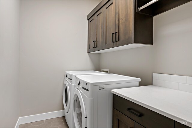 6257 N Vicenza Ln, Meridian, ID 83646 - washroom with washer and dryer, light tile patterned floors, and cabinets