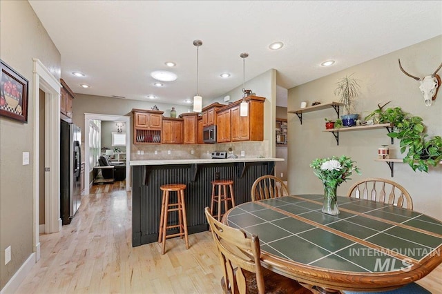 3524 Catalina Ave, Caldwell, ID 83605 - dining room featuring light wood-type flooring and recessed lighting