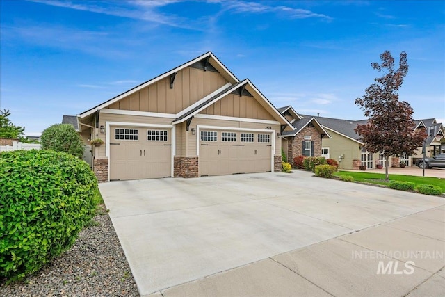 3524 Catalina Ave, Caldwell, ID 83605 - craftsman house with board and batten siding, an attached garage, stone siding, and driveway