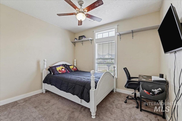 3524 Catalina Ave, Caldwell, ID 83605 - bedroom featuring a textured ceiling, light carpet, baseboards, and ceiling fan