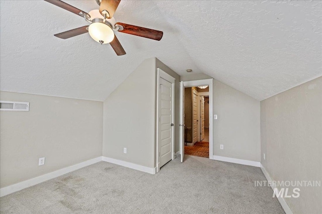 3524 Catalina Ave, Caldwell, ID 83605 - additional living space featuring a textured ceiling, vaulted ceiling, carpet flooring, baseboards, and ceiling fan