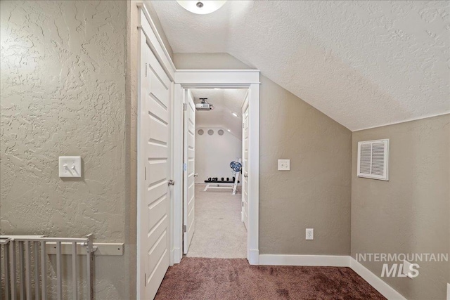 3524 Catalina Ave, Caldwell, ID 83605 - hall with lofted ceiling, a textured ceiling, carpet floors, a textured wall, and baseboards