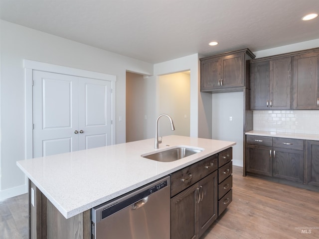 2111 W Gelding St, Middleton, ID 83644 - kitchen with dishwasher, a sink, light wood-style flooring, a kitchen island with sink, and recessed lighting
