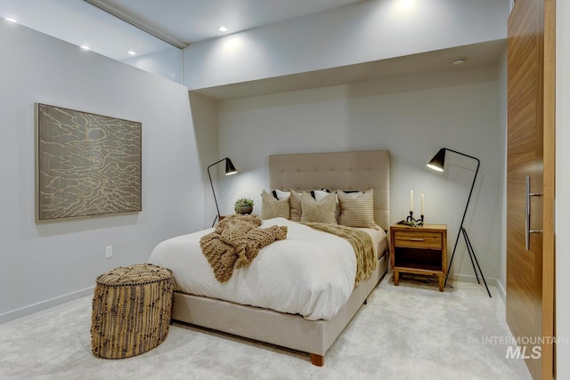 bedroom with light colored carpet