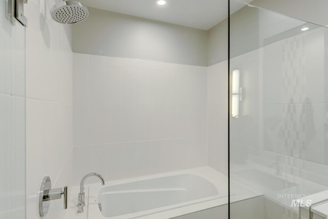 bathroom with shower with separate bathtub