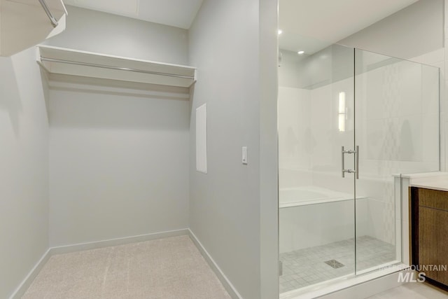 bathroom with vanity and a shower with shower door