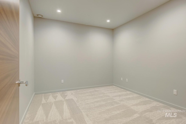 empty room featuring light carpet