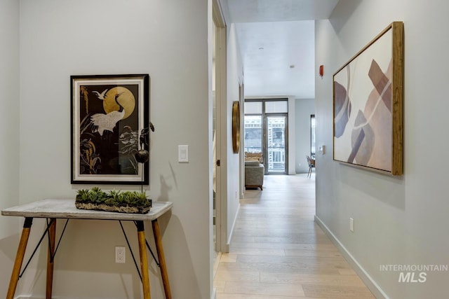 hallway with light wood-type flooring