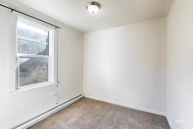 unfurnished room featuring baseboards, a baseboard heating unit, and carpet