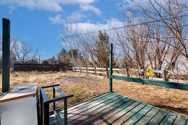 wooden deck featuring fence