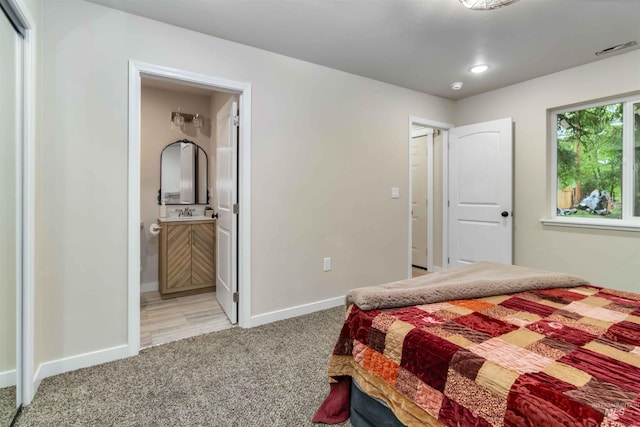 1010 E Main St, Weiser, ID 83672 - bedroom featuring light carpet, baseboards, and ensuite bath