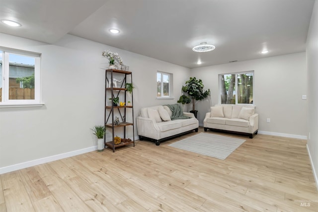 1010 E Main St, Weiser, ID 83672 - living area featuring wood finished floors, baseboards, plenty of natural light, and recessed lighting