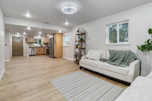 1010 E Main St, Weiser, ID 83672 - living area with baseboards, light wood-type flooring, and recessed lighting