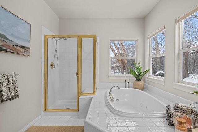 bathroom featuring separate shower and tub