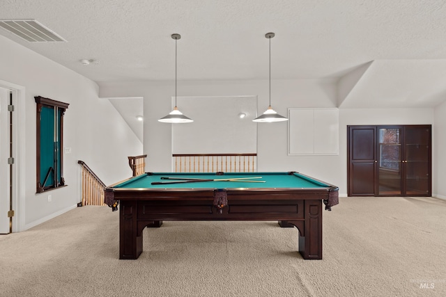 recreation room featuring light carpet, pool table, and a textured ceiling