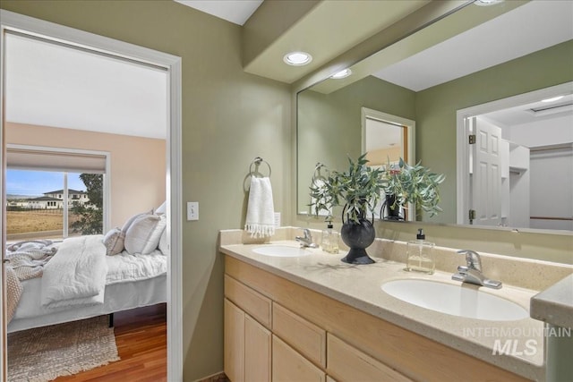 2021 W Ardell Rd, Kuna, ID 83634 - full bath with ensuite bath, double vanity, and wood finished floors