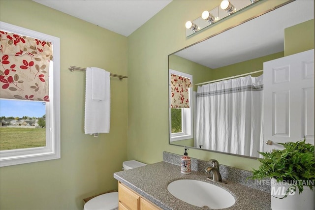 2021 W Ardell Rd, Kuna, ID 83634 - bathroom with vanity, toilet, and a shower with shower curtain