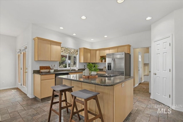 2021 W Ardell Rd, Kuna, ID 83634 - kitchen featuring stainless steel appliances, stone tile flooring, light brown cabinets, baseboards, and recessed lighting