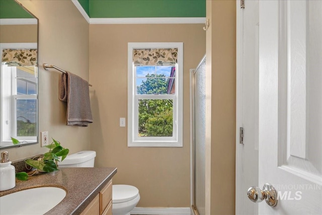 2021 W Ardell Rd, Kuna, ID 83634 - bathroom with vanity, toilet, a stall shower, crown molding, and baseboards