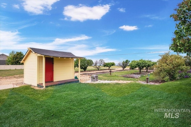 2021 W Ardell Rd, Kuna, ID 83634 - view of green lawn featuring a storage unit and an outdoor structure