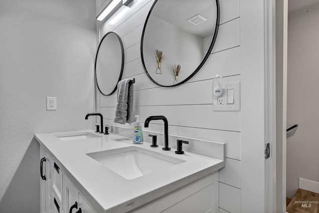 bathroom featuring double vanity