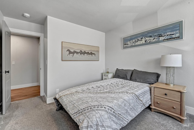 carpeted bedroom with baseboards