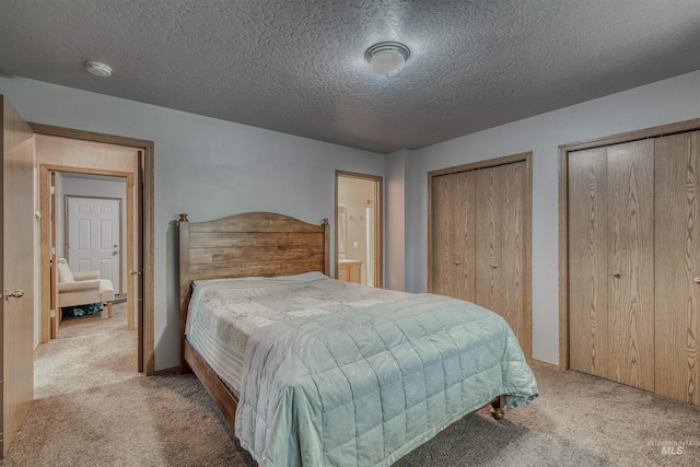 2209 S Plateau Dr, Nampa, ID 83686 - bedroom with carpet, two closets, and a textured ceiling
