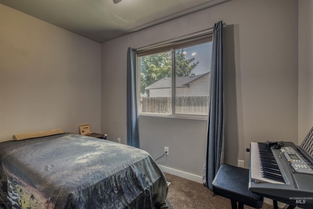 2209 S Plateau Dr, Nampa, ID 83686 - bedroom featuring dark colored carpet and baseboards