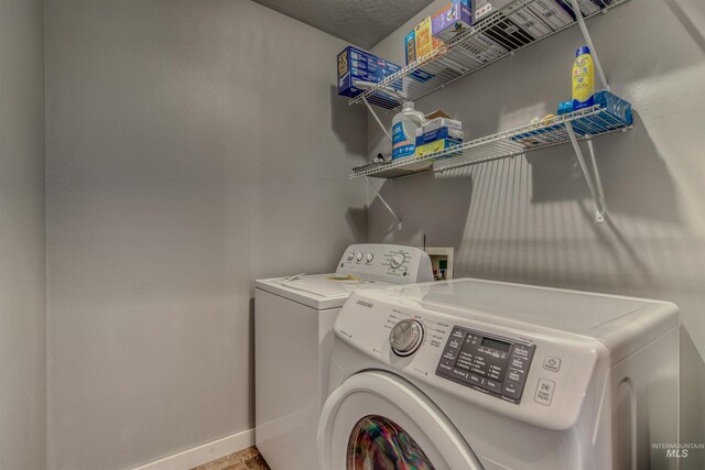 2209 S Plateau Dr, Nampa, ID 83686 - laundry room featuring washer and clothes dryer and baseboards