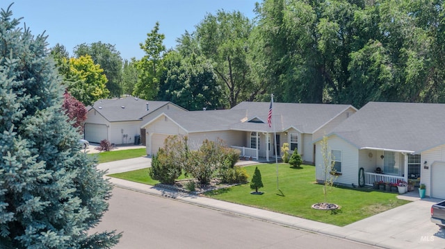 2209 S Plateau Dr, Nampa, ID 83686 - ranch-style house with driveway, an attached garage, a front yard, and covered porch