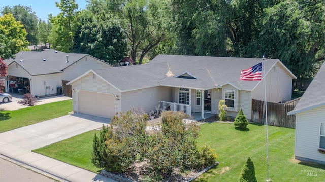 2209 S Plateau Dr, Nampa, ID 83686 - ranch-style home with a garage, concrete driveway, and covered porch