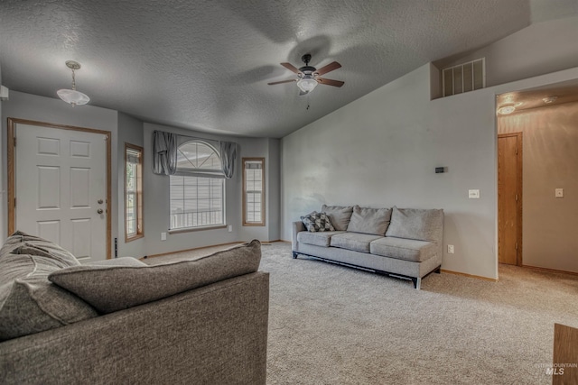 2209 S Plateau Dr, Nampa, ID 83686 - carpeted living area with a textured ceiling and ceiling fan