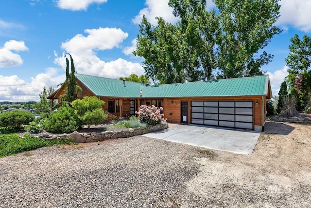 8315 Elk Ridge Ln, Middleton, ID 83644 - view of front of property featuring driveway, an attached garage, and metal roof