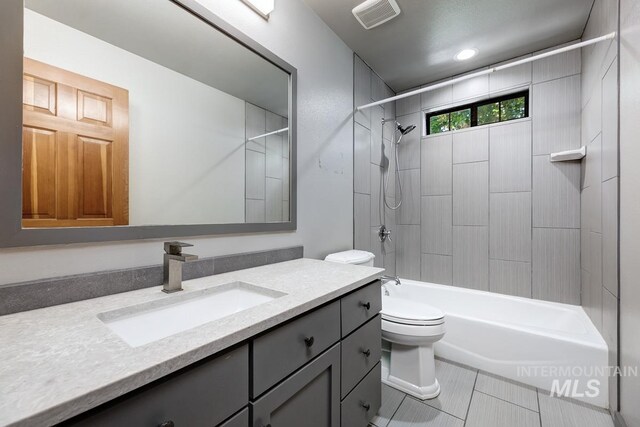 8315 Elk Ridge Ln, Middleton, ID 83644 - bathroom with vanity, toilet, bathtub / shower combination, and tile patterned floors