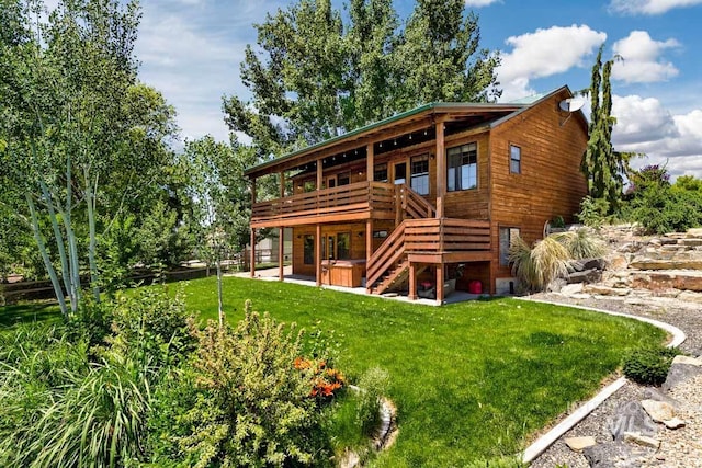 8315 Elk Ridge Ln, Middleton, ID 83644 - rear view of property featuring a yard, a wooden deck, stairway, and a patio
