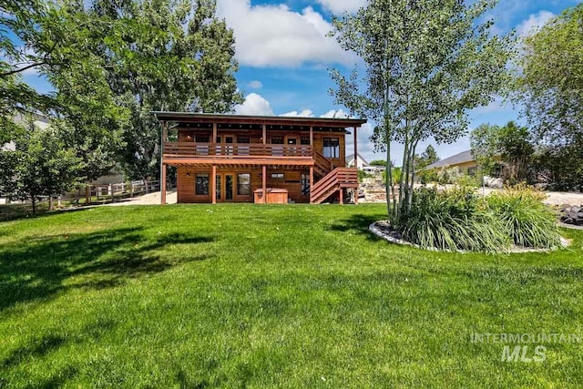 8315 Elk Ridge Ln, Middleton, ID 83644 - rear view of property with a wooden deck, a lawn, and stairs