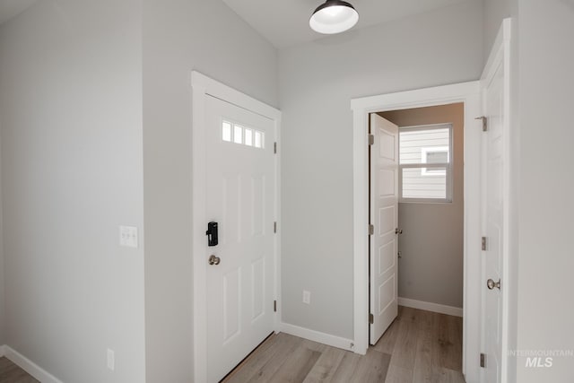 foyer entrance with light hardwood / wood-style floors