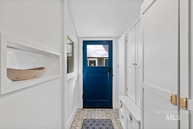 doorway to outside featuring light floors